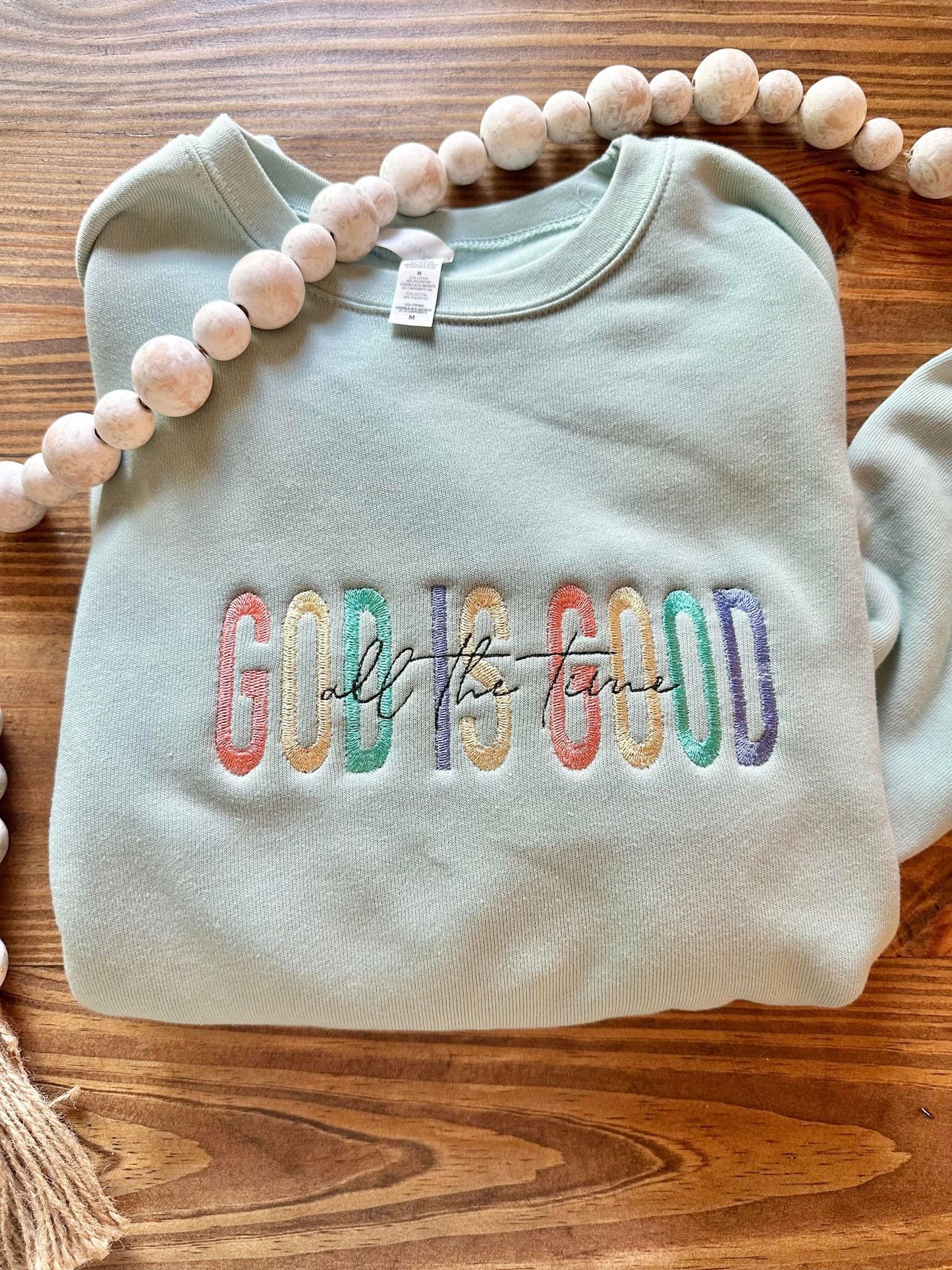 God is good all the time sweater flat lay