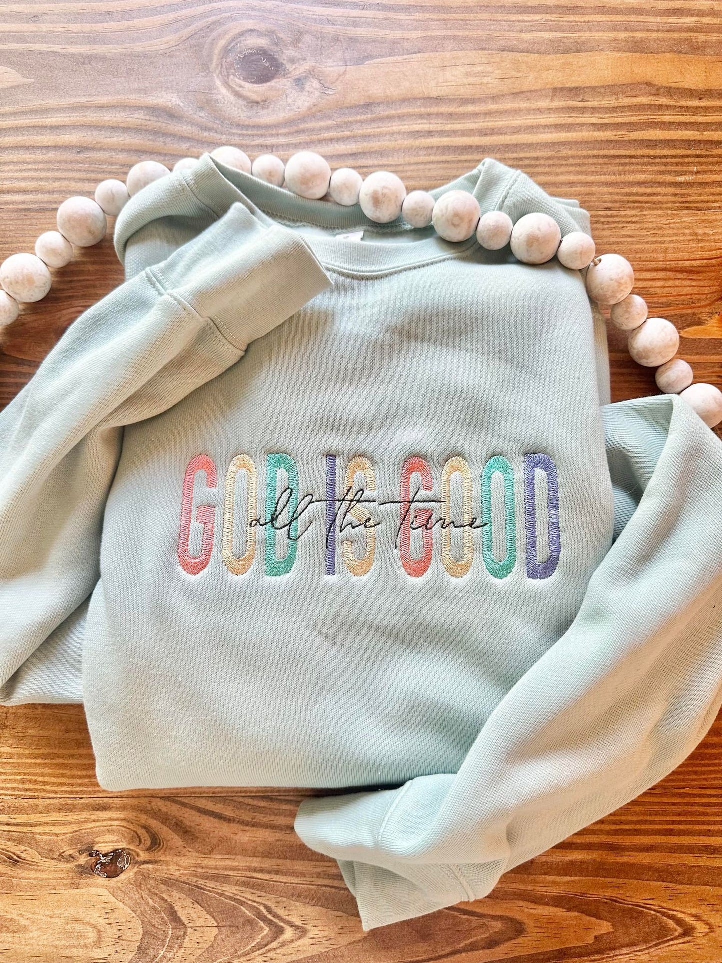 God is good all the time sweater flat lay