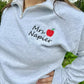 Embroidered Teacher name with Apple on Quarter Zip Sweater shown in the Color Ash - On Model